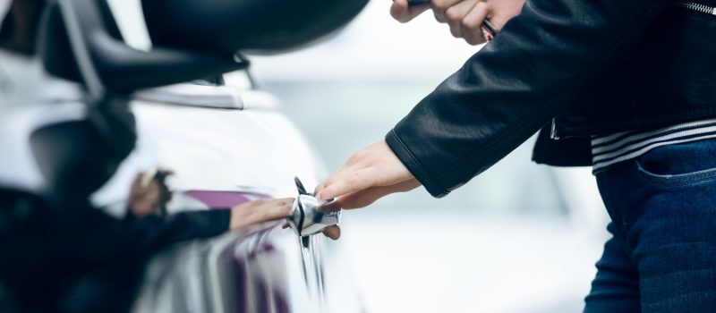 beautiful-young-woman-opening-her-car