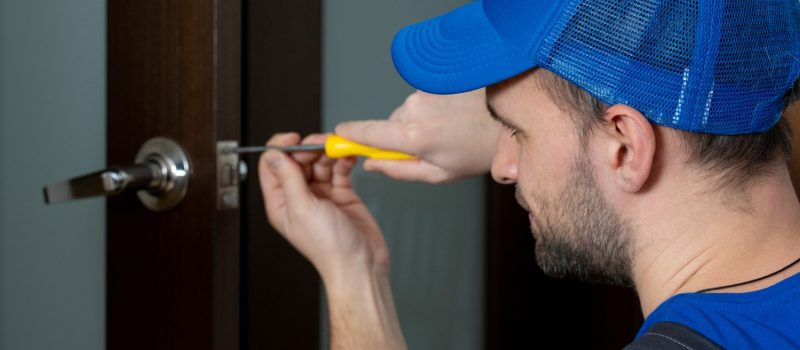 handyman-repair-door-lock-room-closeup-man-repairing-doorknob