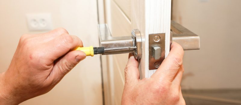 man-is-installing-doors-handle-repair-works-maintenance-apartment
