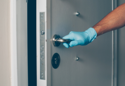 portrait-man-room-opening-door-with-hands-gloves 1